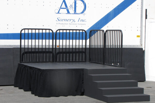 Staging with skirting, safety railings, & step unit