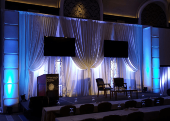 Quest Events Symposium Stage Backdrop white Drape FormSet Towers Layers Screen Surround rental 1