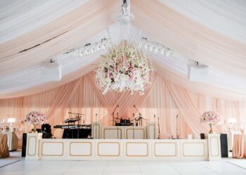 layered blush sheer wedding tent reception band backdrop drape quest events