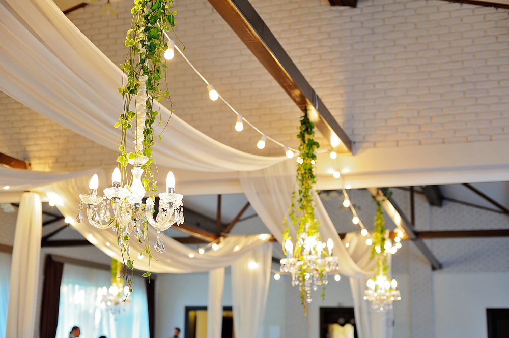Ceiling drape with tulle and eclectic chandeliers